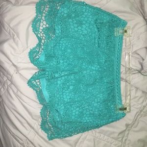 teal lace shorts.